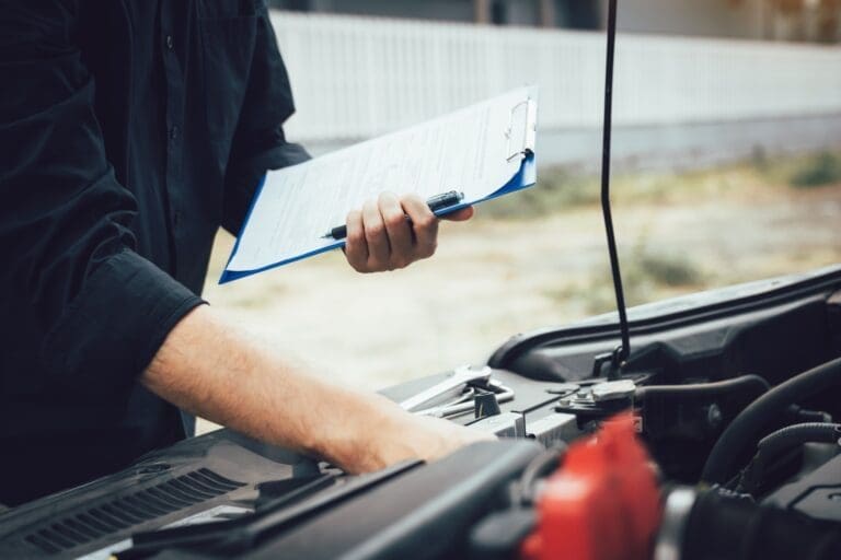 Car mechanic repairing vehicle engine working job.