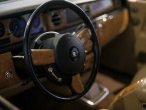 A rolls-royce steering wheel and interior details.